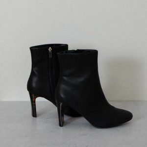 Tortoise shell heel black leather boots